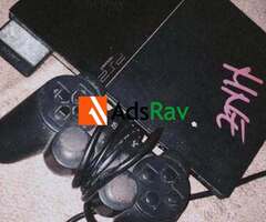 PS2 for sale with 8 games - 2